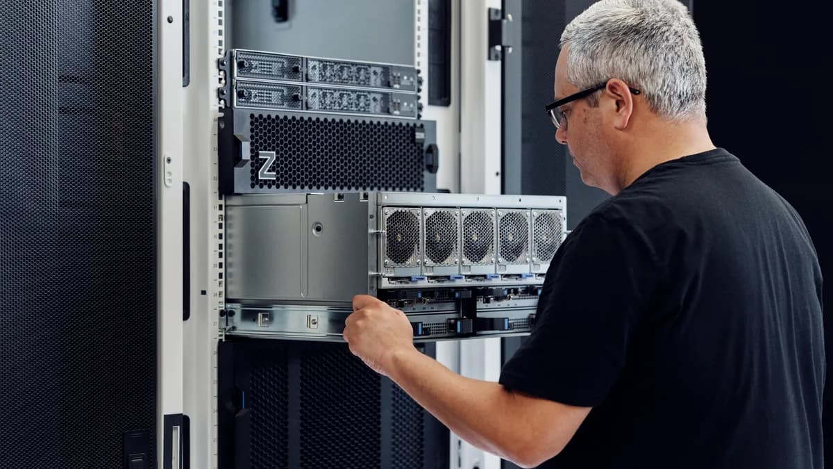 Technician installing an IBM z17 rack-mount drawer — IBM newsroom photography, not AGICY inventory
